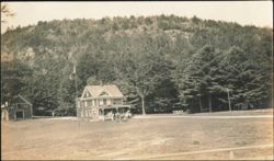 Group of People Gathered at a House with a Flagpole Postcard