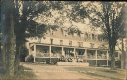 Friends Lake Inn with Guests on Porch Postcard