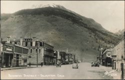 Business District Looking Toward Mountain Postcard