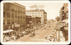 Main Street with Owyhee Hotel and Granada Theatre Postcard
