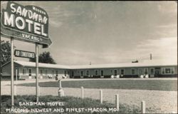 Modern Sandman Motel with Prominent Neon Sign Postcard