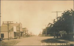 Dirt Road Street Scene with Storefronts and Hotel Postcard