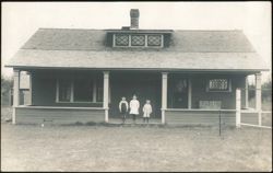 Three Children Standing on Porch of Craftsman Bungalow Postcard
