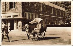 Rickshaw Taxi and Puller Outside Stone Building Postcard
