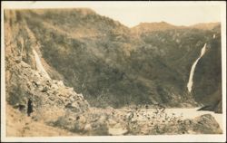 Person Standing Near Two Waterfalls in Mountain Landscape Postcard