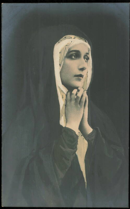 Woman in Religious Habit with Hands Clasped in Prayer