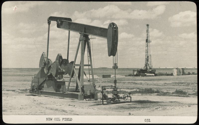 New Oil Field with Pumpjack and Drilling Derrick Ellis Kansas