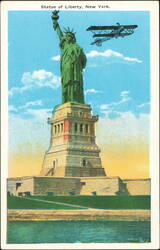 Statue of Liberty with Biplane over New York Bay Postcard