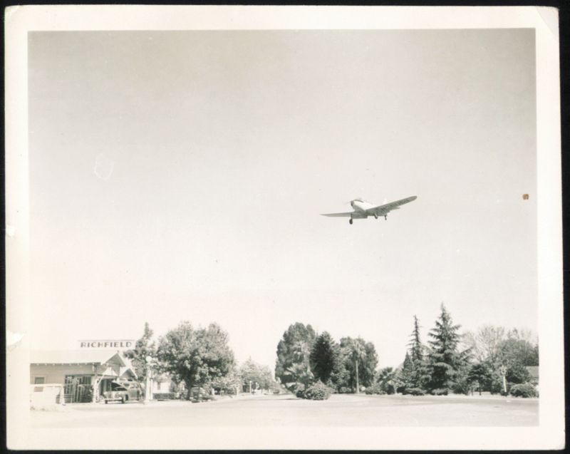 Airplane Flying Over Richfield Gas Station Aircraft
