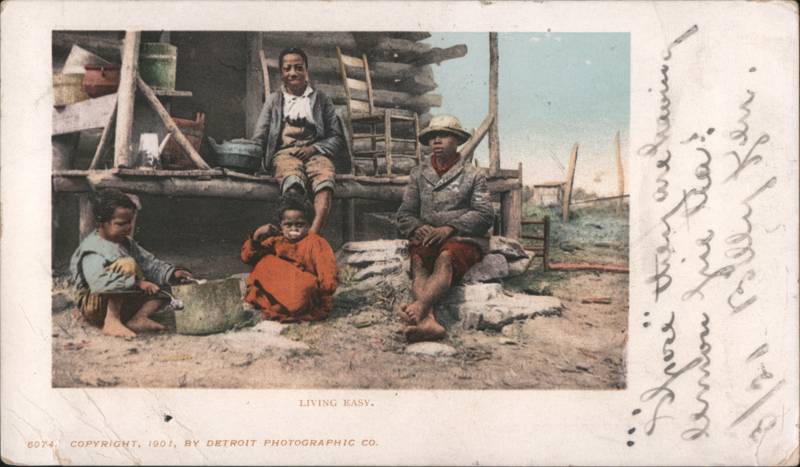 Living Easy African American Family by Log Cabin