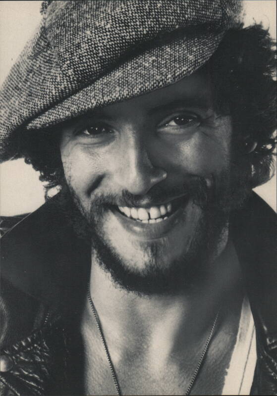 Bruce Springsteen Smiling Portrait in Flat Cap