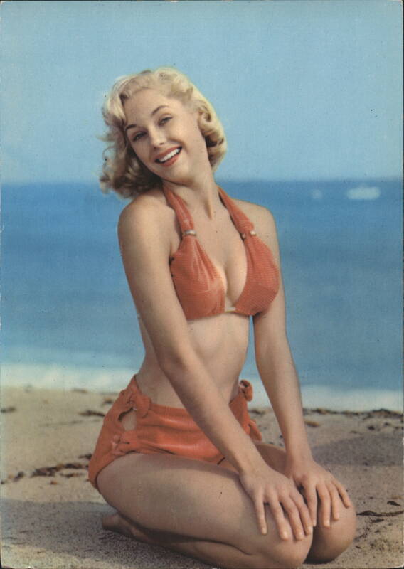 Smiling Blonde Pin-Up Model in Orange Bikini on Beach