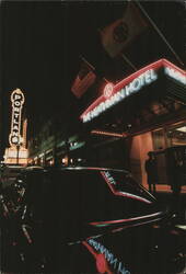 The Heathman Hotel and Portland Sign at Night Postcard
