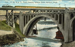 C. M. & St. P. Train Crossing Spokane River Postcard