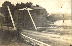 Bridge by waterfall Postcard