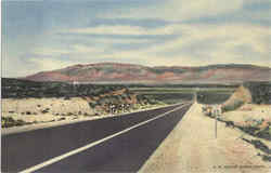 Highway U. S. 66 Entering Rio Grande Valley at Albuquerque N. Mex. With Sandia Mountains in the Background Postcard