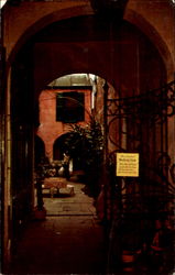 Looking Through The Wishing Gate Into The Green Orchid Patio, 616 Royal Street Postcard