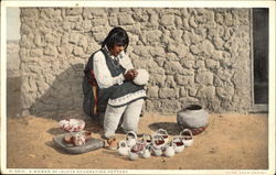 A Woman Of Isleta Decorating Pottery Postcard