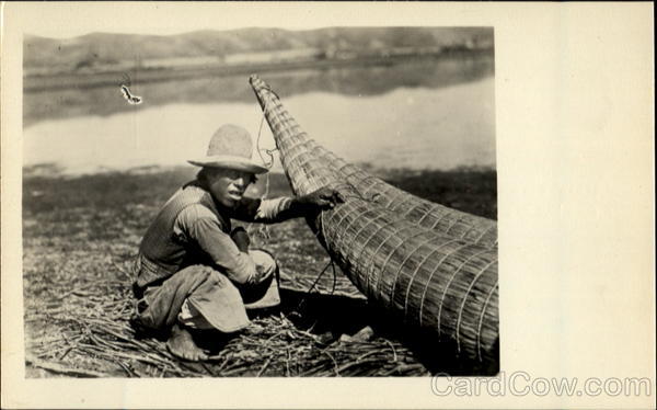 Indian Repairing His Straw Boat Bolivia