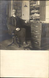 Man at Desk Laramie, WY Postcard Postcard
