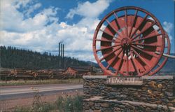 Giant Logging Wheels at Western Entrance to Flagstaff, Arizona Postcard