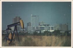 Pump Jack Pumping Texas Gold, City of Midland in Background Postcard
