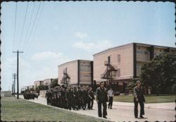 Lackland Air Force Base Trainees Marching Past Dormitories Postcard