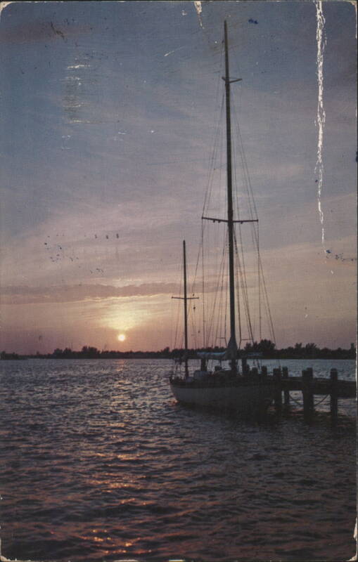 Sailboat Berthed at Dock During Sunset Hannau Sailboats