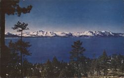 View of Lake Tahoe and Snow-Capped Mountains Postcard