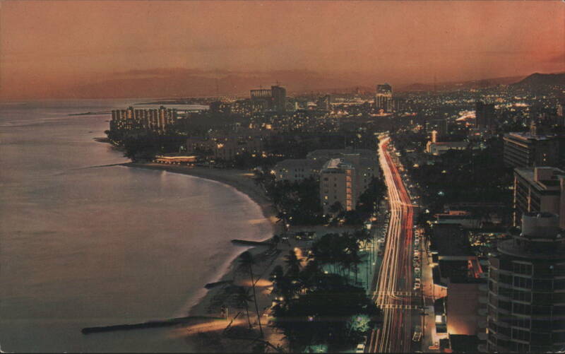 Evening View of Kalakaua Avenue in Waikiki at Sunset Honolulu Hawaii