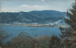 Lumber Mill in Garibaldi, OR Harbor with City and Mountains Postcard