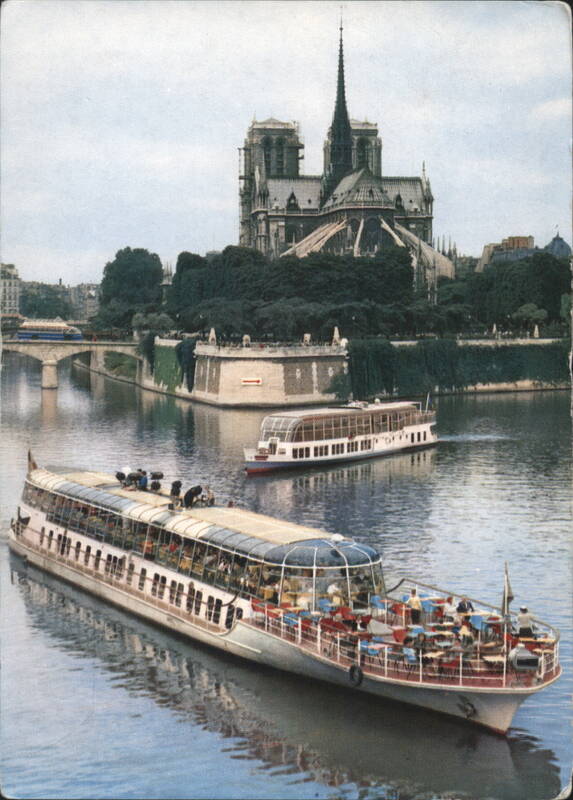 Bateaux Mouches Tour Boats on Seine River with Notre-Dame Paris France