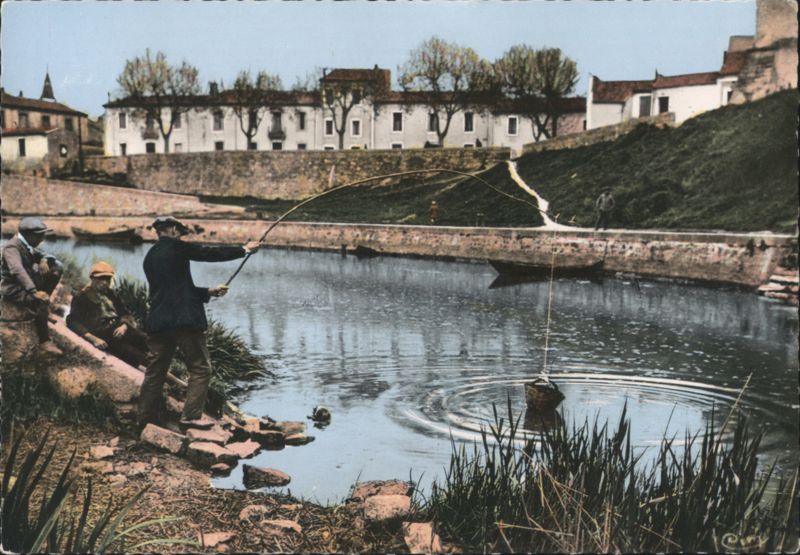 Men Fishing by a River in Lunel France