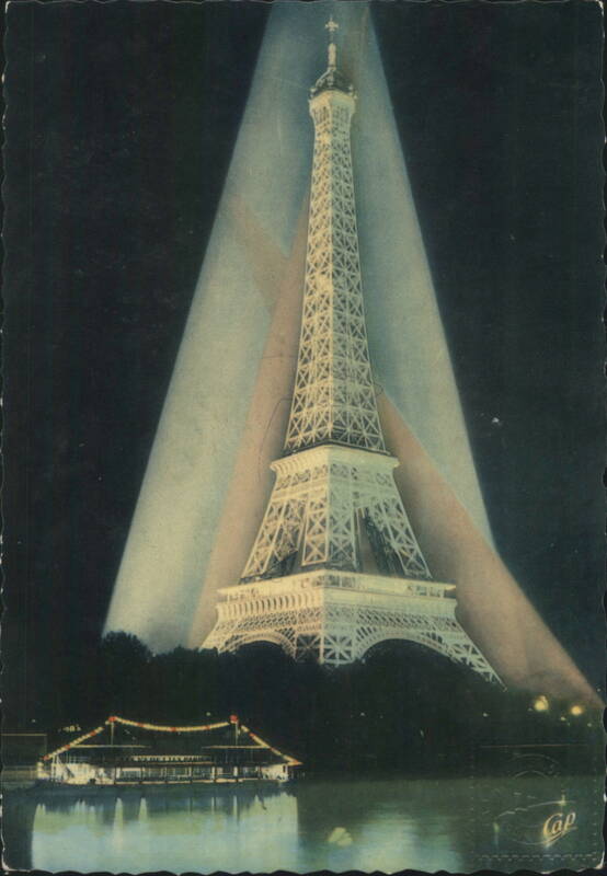 Eiffel Tower Illuminated at Night with Seine River Boat Paris France