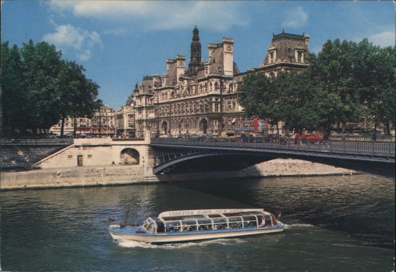 L'Hôtel de Ville and the Seine River with Bateaux Mouches Paris France