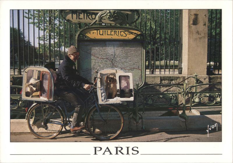 Man with Owl and Animals on Bicycle at Paris Métro France