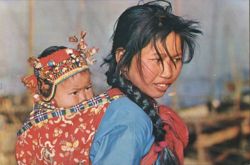 Young Chinese Girl Carrying a Baby in New Year Finery Postcard