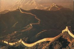 The Great Wall winding through mountainous terrain Postcard