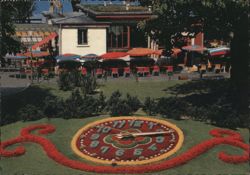 Floral Clock in Geneva Garden with Outdoor Cafe Postcard