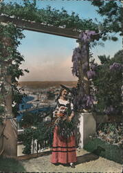 Nice among the flowers, local costume Postcard