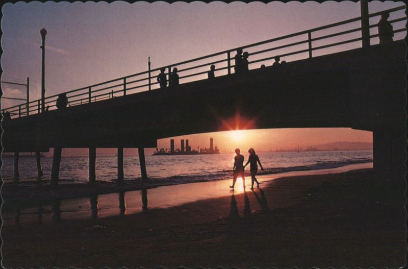Sunset View of Belmont Pier, Long Beach with Silhouetted Figures California