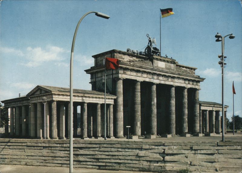 Brandenburg Gate with Wall and German Flag, Berlin Germany