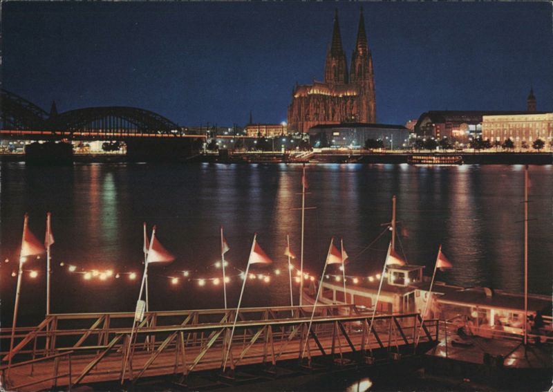 Cologne Cathedral and Hohenzollern Bridge over Rhine at Night Germany
