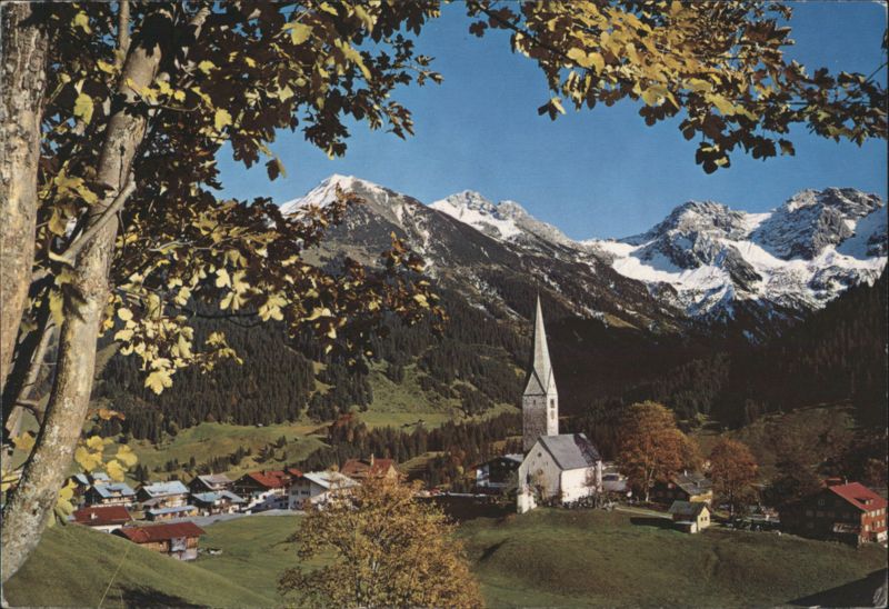 Village Church and Snow-capped Mountains in Kleinwalsertal Mittelberg Austria