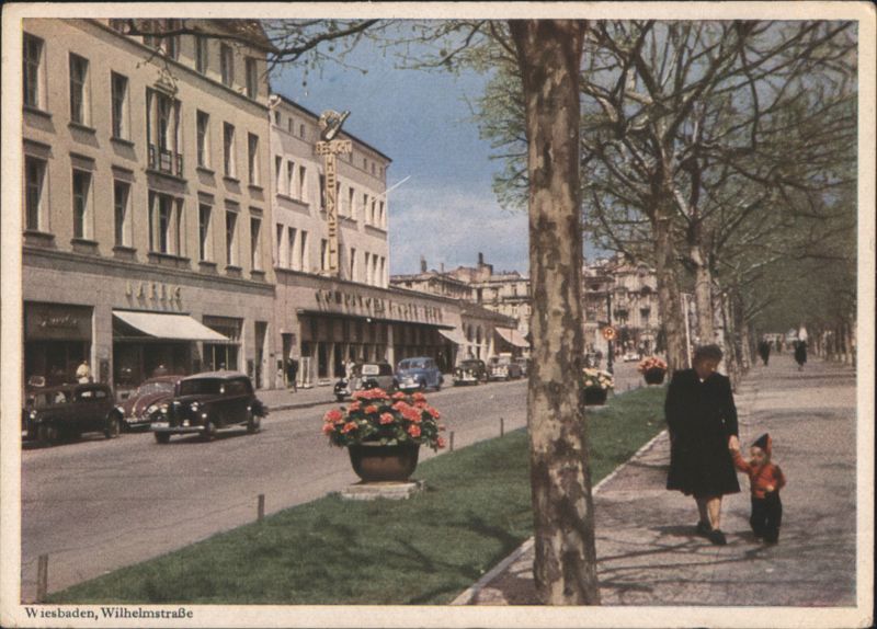 Wiesbaden: Wilhelmstraße with Flowers and Pedestrians Germany