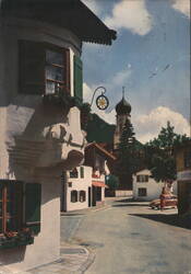 Oberammergau Street Scene with Sternwirt-Eck & Church Tower Postcard