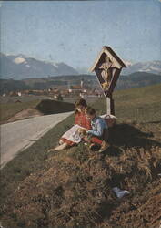 Children by a Wayside Cross with Alps in Vachendorf Postcard
