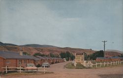 Branding Iron Motel Log Cabins, Dubois, Wyoming Postcard