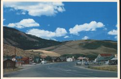 Centennial, Wyoming Roadside View with Gas Stations Postcard