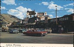 Jackson, Wyoming Street Scene with Ranch Shops & Mountains Postcard